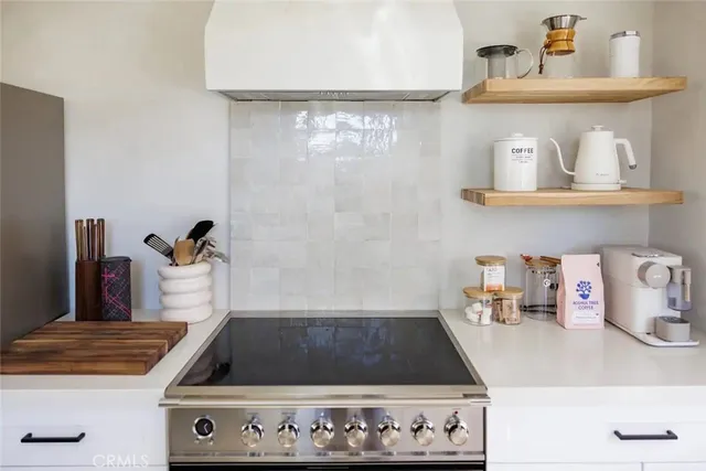 a dining room with furniture and a large window