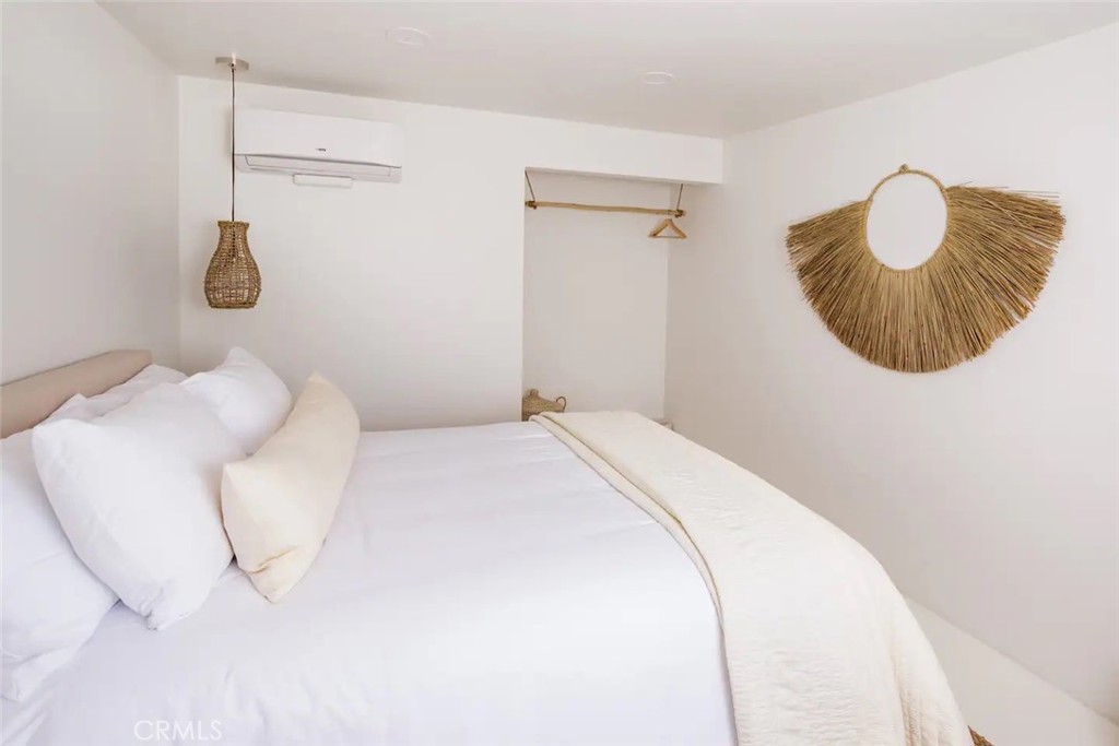 6979 White Feather Road Joshua Tree, CA 92252 - Photo 40 of 44 a bedroom with a bed and a couch