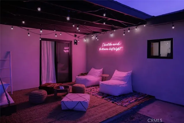 a outdoor living space with furniture and a fireplace