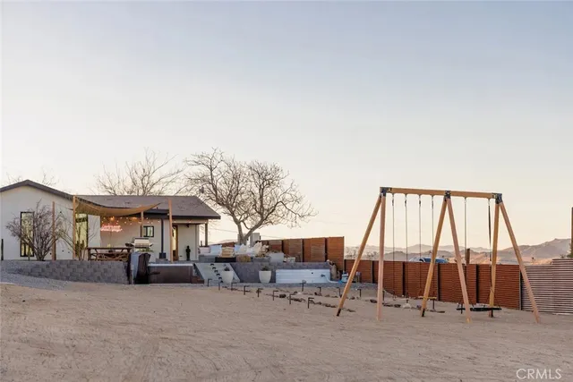 a terrace with outdoor seating and city view