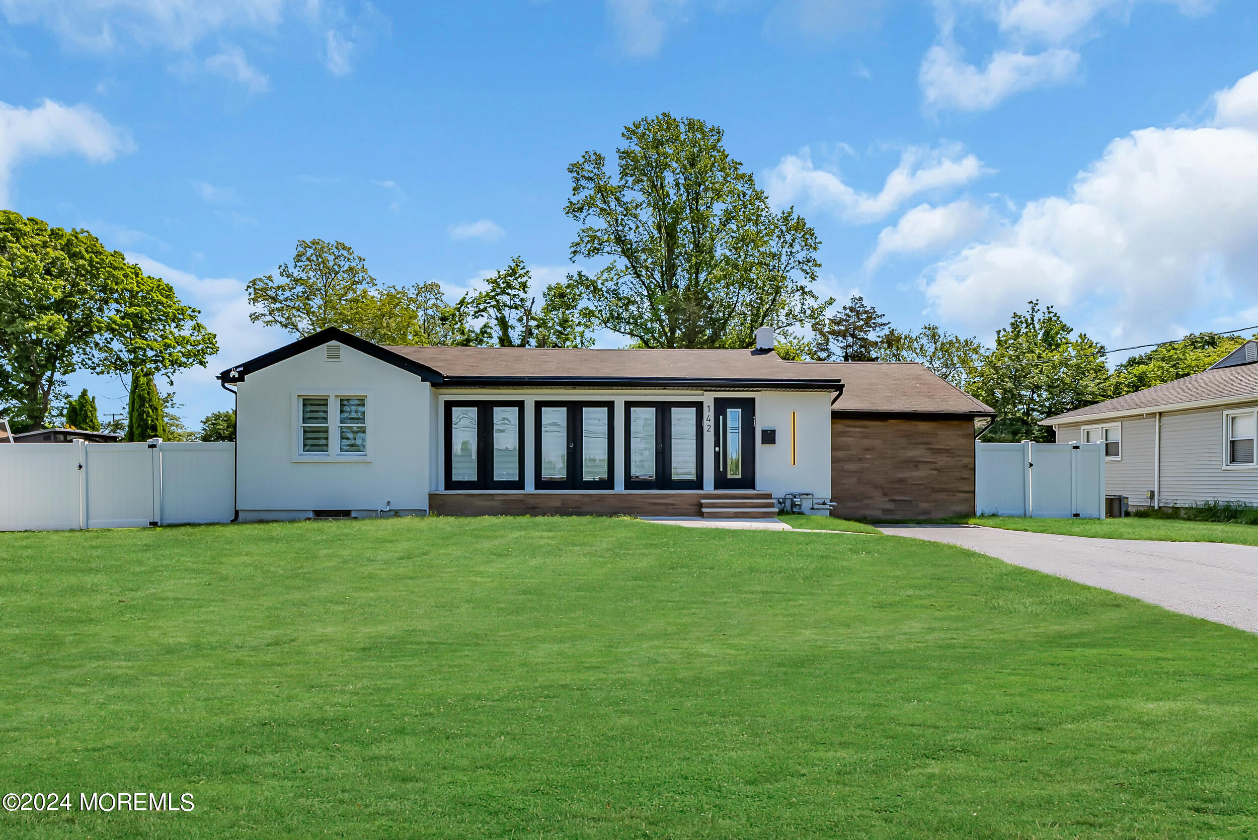142 Locust Avenue West Long Branch, NJ 07764 - Photo 1 of 35 a view of a house with a yard and a tree