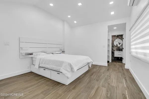 a view of a room with wooden floor