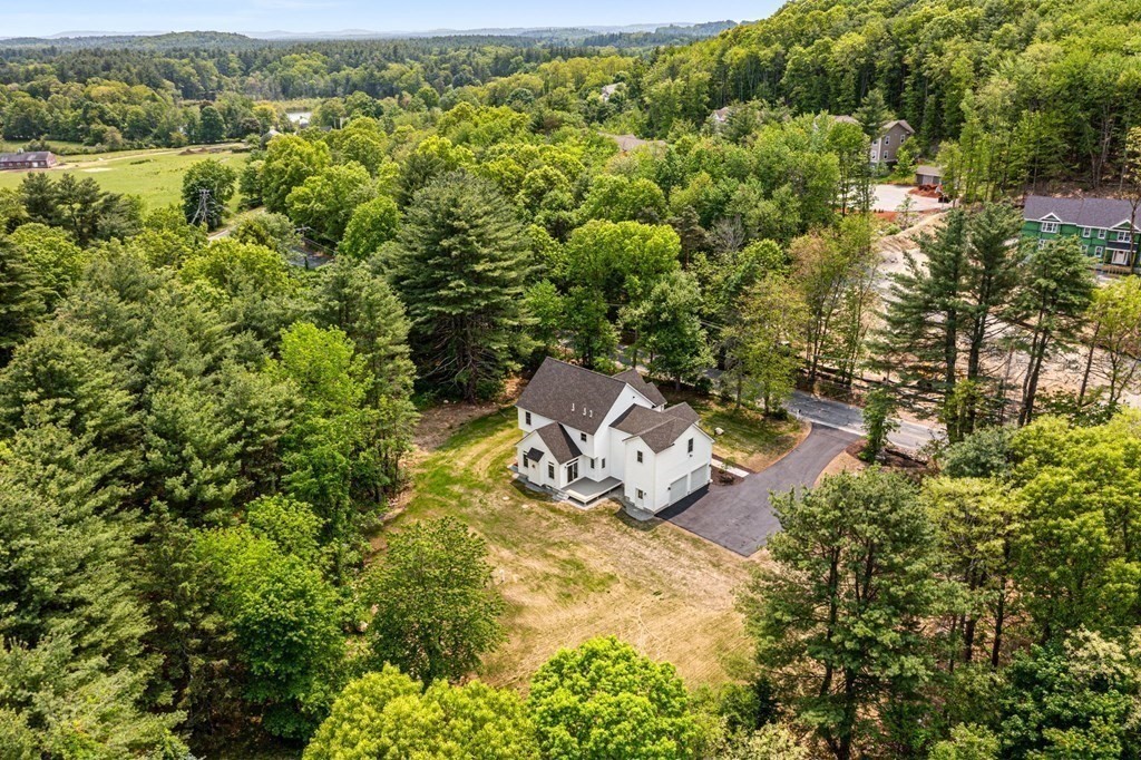 17 Boxboro Road Stow, MA 01775 - Photo 5 of 40 an aerial view of a house with a yard and lake view