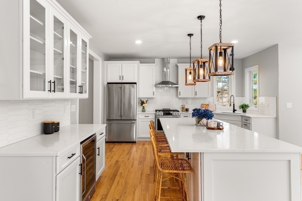 17 Boxboro Road Stow, MA 01775 - Photo 10 of 40 a kitchen with stainless steel appliances a sink stove and refrigerator
