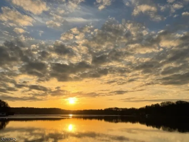 a view of outdoor space with deck and yard