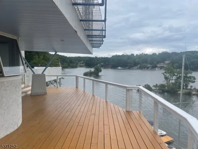 a wooden bench sitting next to a lake