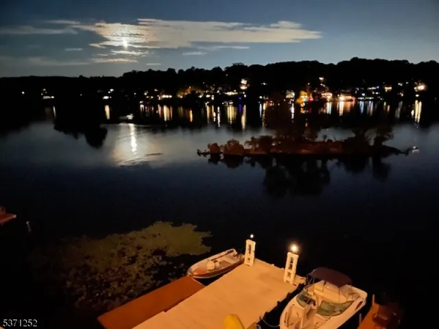 a living room with furniture and large window
