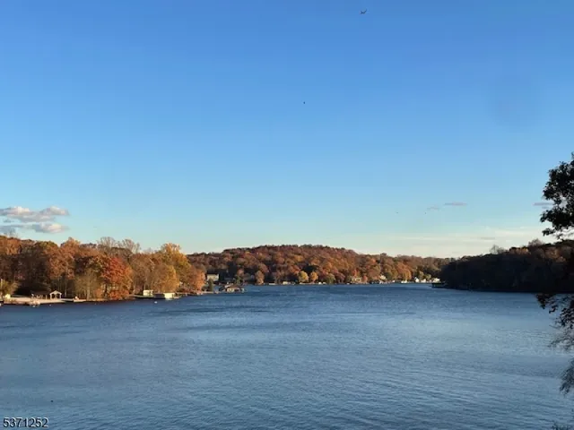 a balcony with wooden floor potted plants with wooden floor and fence