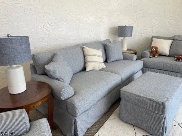 a view of a living room with furniture