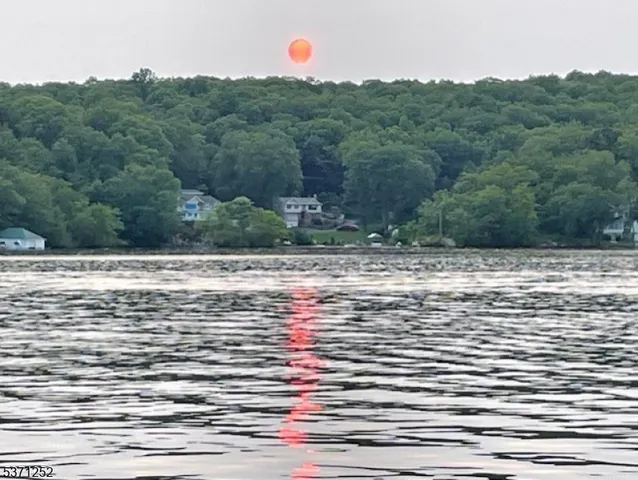 a room with a bed and a night stand