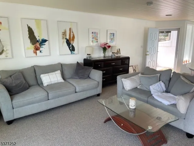 an aerial view of a houses with ocean view