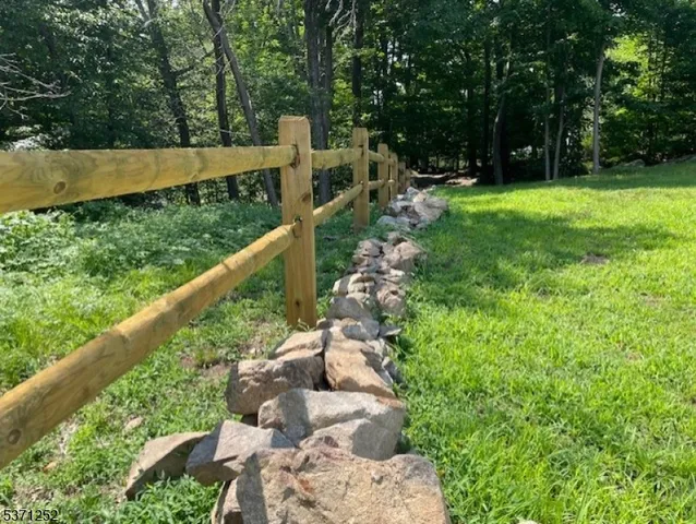 a view of a balcony with wooden floor and city view