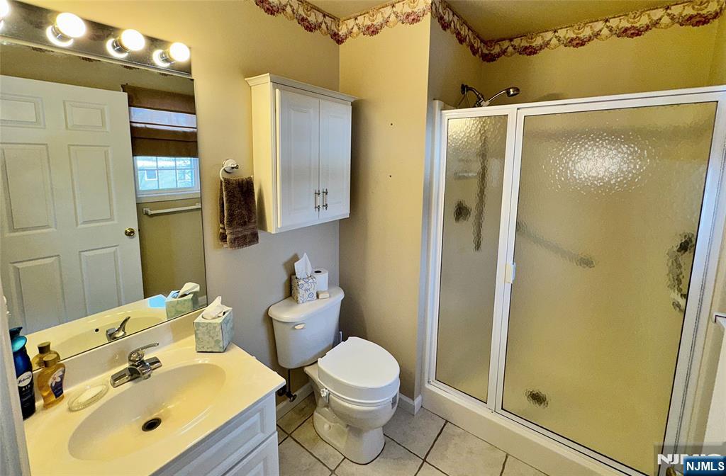 34 Chanda Court, Unit D034 Clifton, NJ 07012 - Photo 19 of 24 a bathroom with a sink toilet and shower