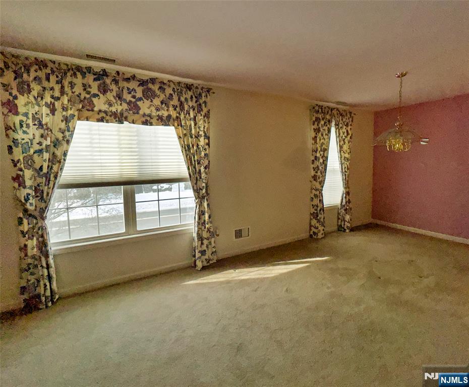 34 Chanda Court, Unit D034 Clifton, NJ 07012 - Photo 6 of 24 an empty room with windows