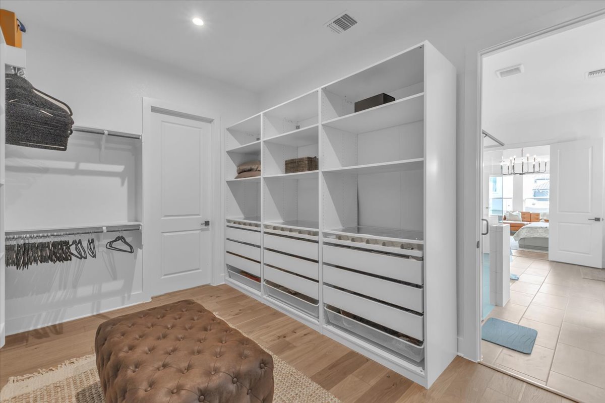 2312 Mondello Path Leander, TX 78641 - Photo 19 of 40 Walk in closet with light wood finished floors