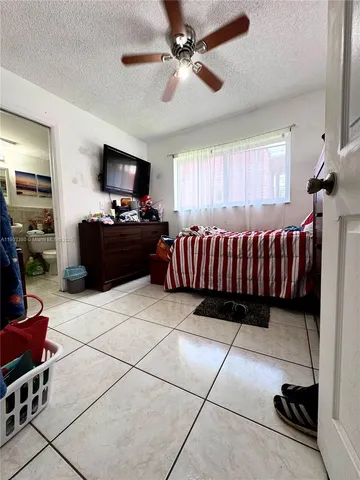 a living room with a couch and a flat screen tv