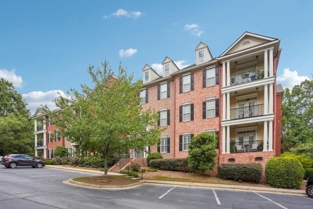 4805 Ivy Ridge Drive Southeast, Unit 204 Atlanta, GA 30339 - Photo 1 of 1 a front view of a building with street view