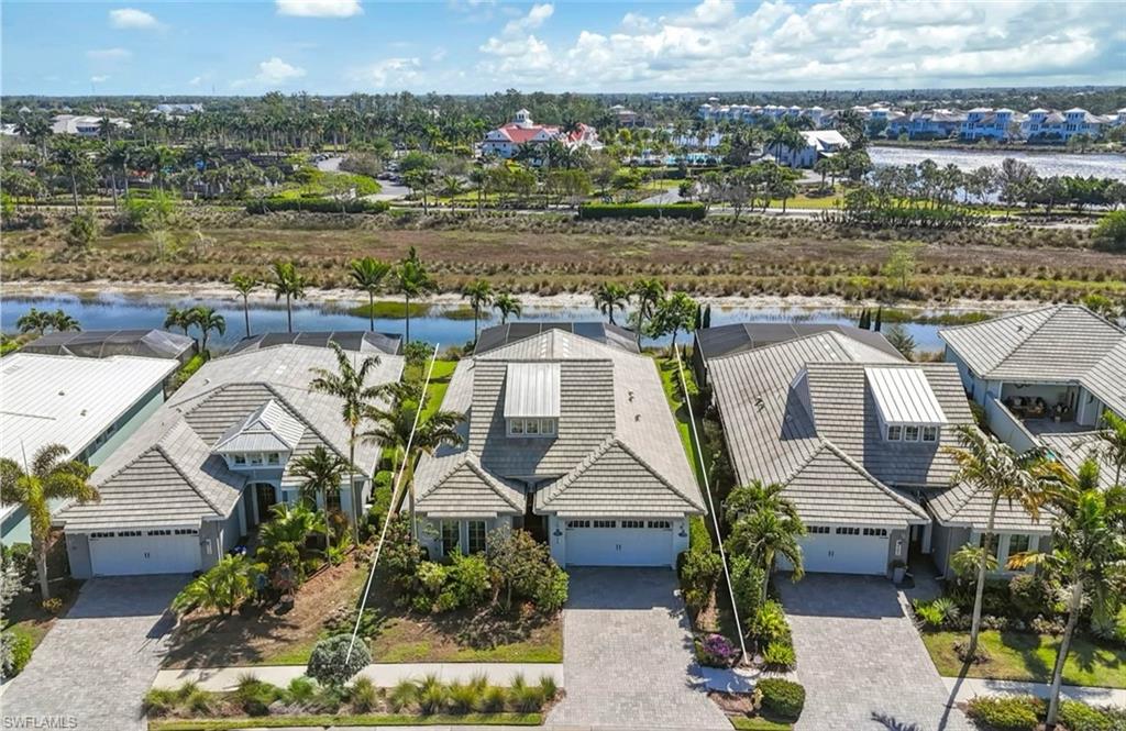 6466 Warwick Avenue Naples, FL 34113 - Photo 27 of 43 an aerial view of a house with a lake view