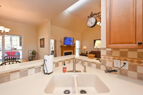 a very nice looking room with a large window and furniture