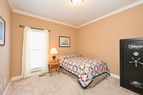 a bedroom with a bed and a table