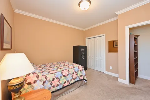 a bedroom with a bed and walk in closet