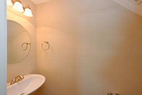 a bathroom with a sink and mirror