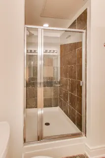 a bathroom with a shower and a bathtub