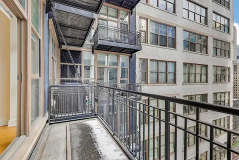 a view of a brick building from a balcony