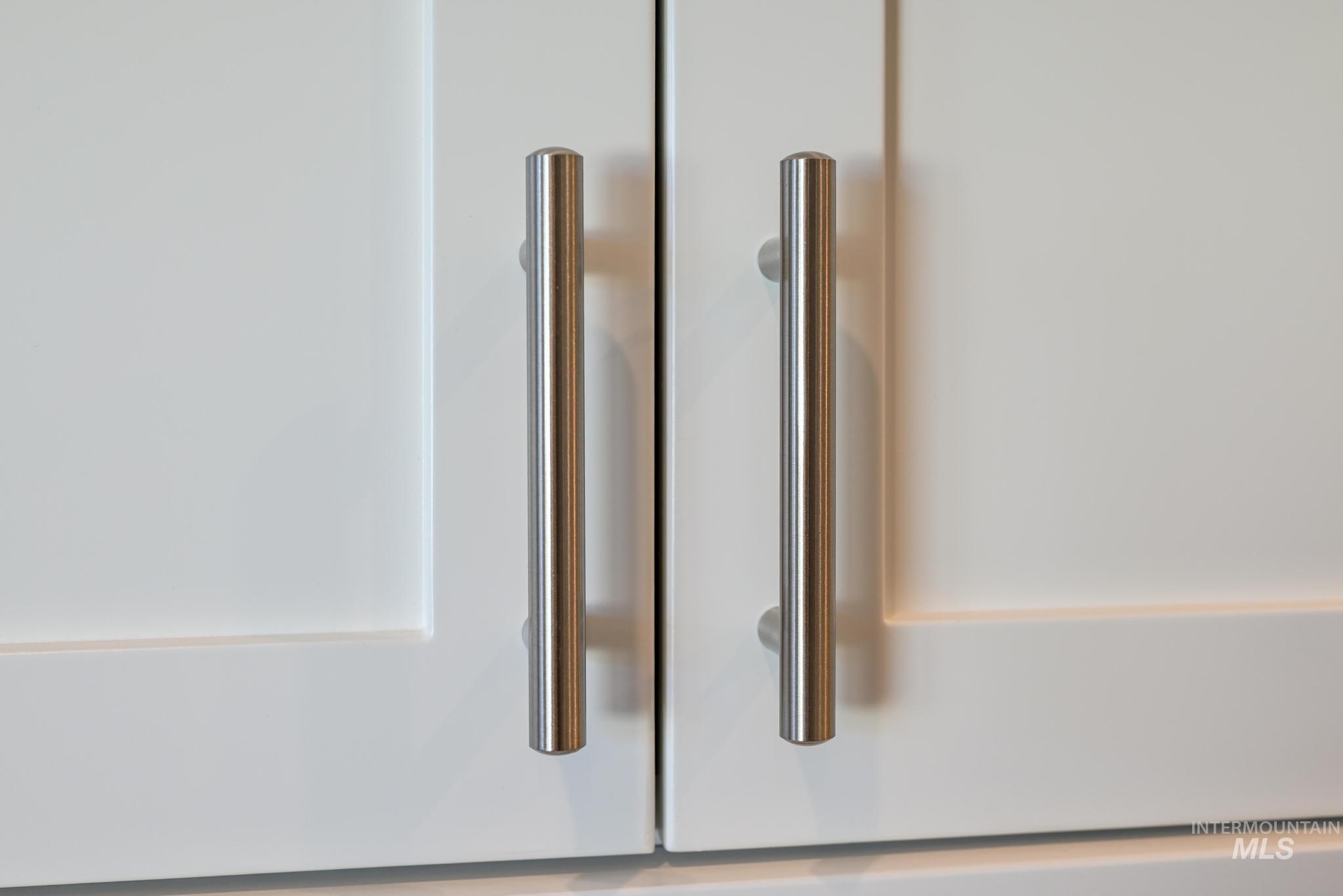9074 West Moonglade Street Star, ID 83669 - Photo 16 of 40 White shaker-style cabinetry featuring brushed nickel bar pulls