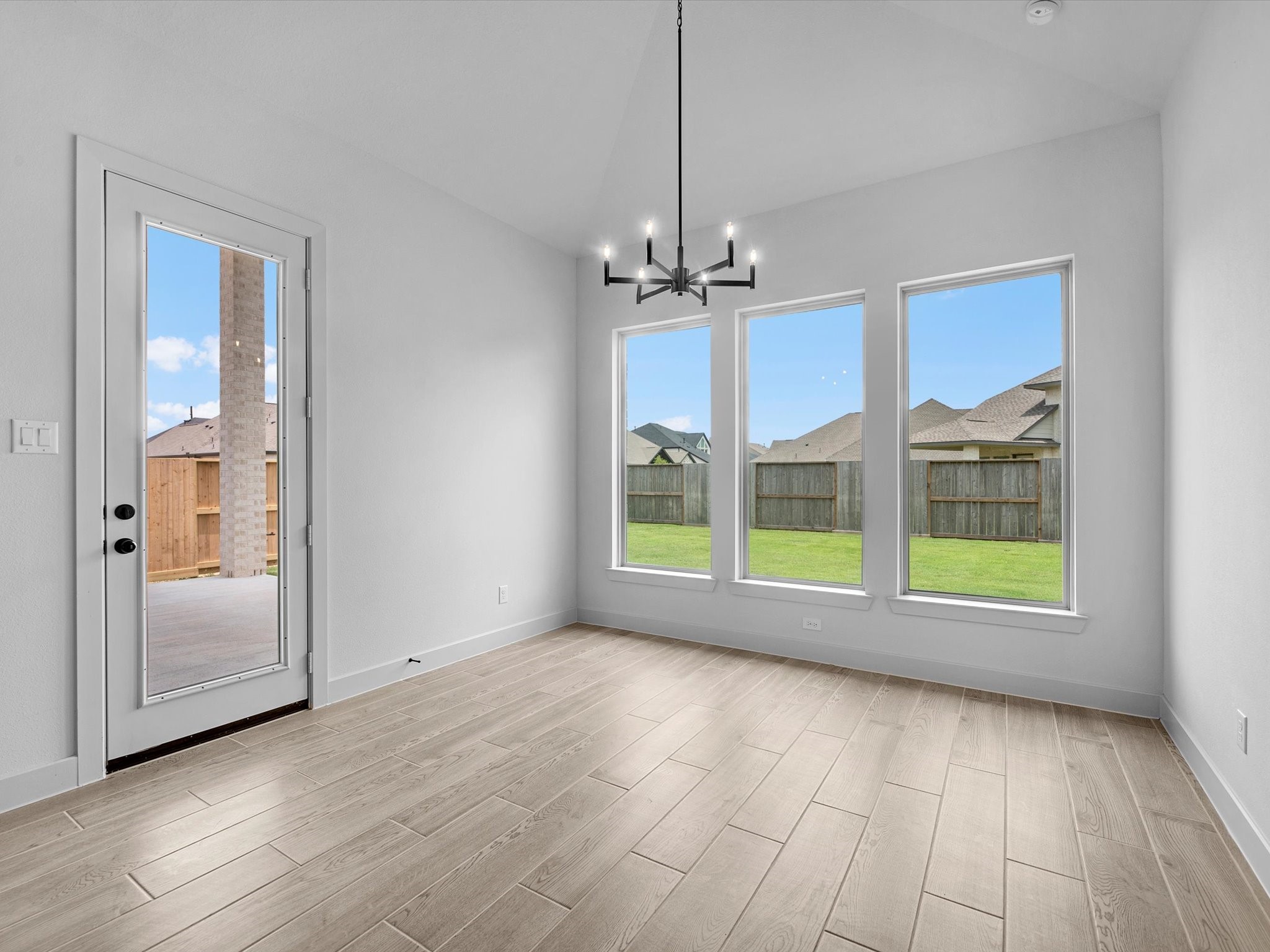 8915 Acropolis Lane Manvel, TX 77578 - Photo 11 of 32 a view of an empty room with a window