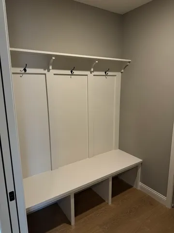 a room with a table and white walls