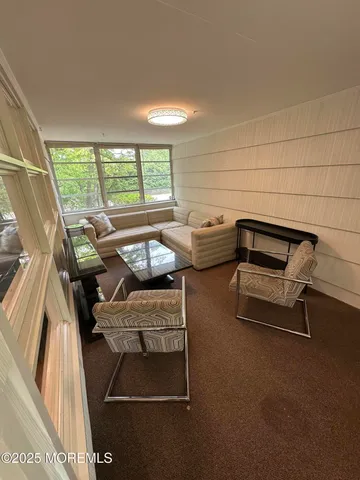 a room with gym equipment and a large window