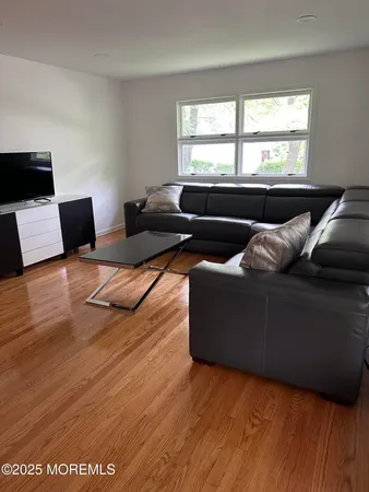 a living room with furniture and windows