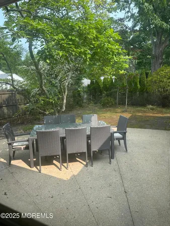 a view of a backyard with a chair and a stove