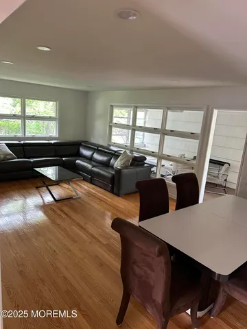 a living room with furniture window and a table