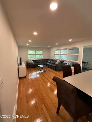 a lobby with furniture and a rug