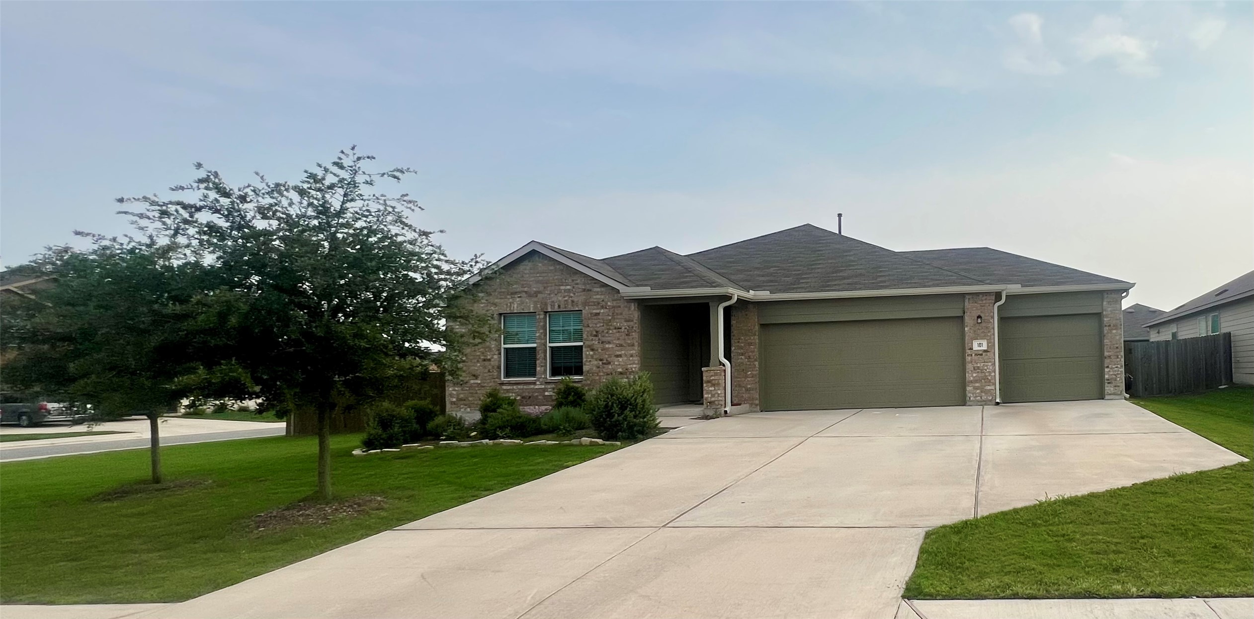 101 River Rise Road Kyle, TX 78640 - Photo 1 of 1 a front view of a house with a yard and trees