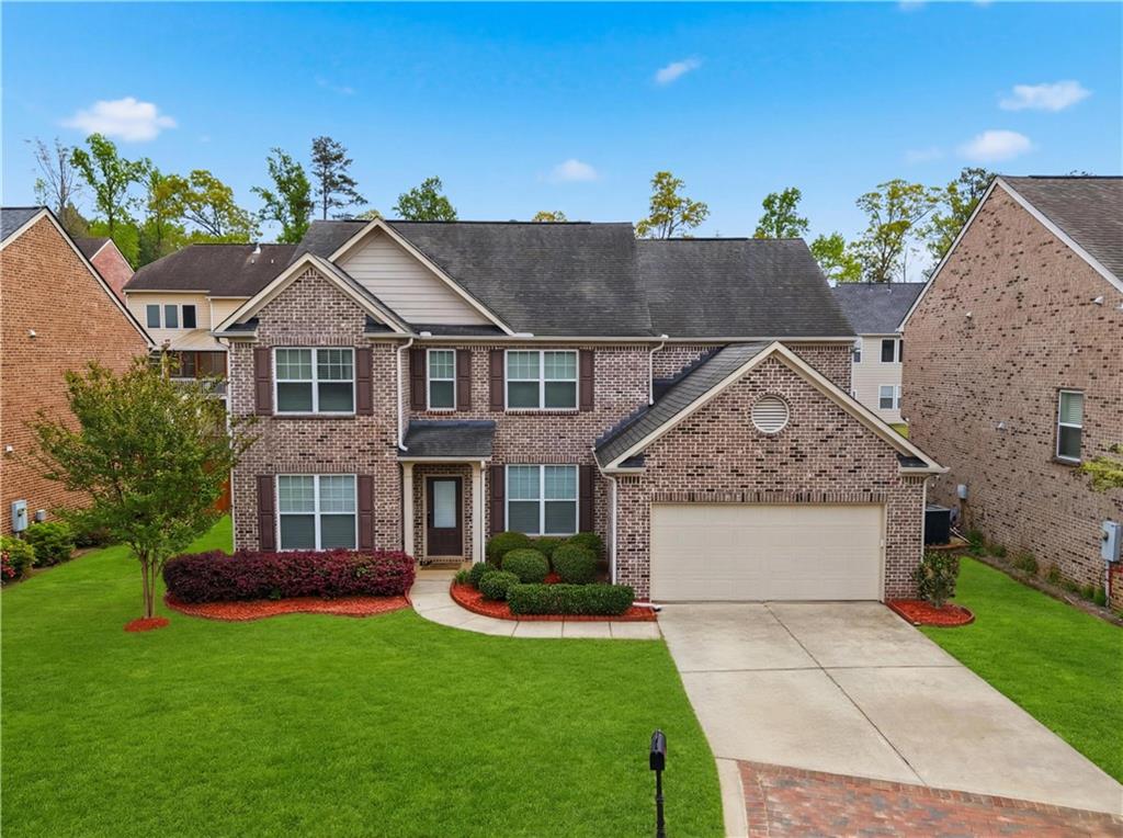 2572 Larson Creek Way Northwest Duluth, GA 30097 - Photo 1 of 50 front view of house with a yard