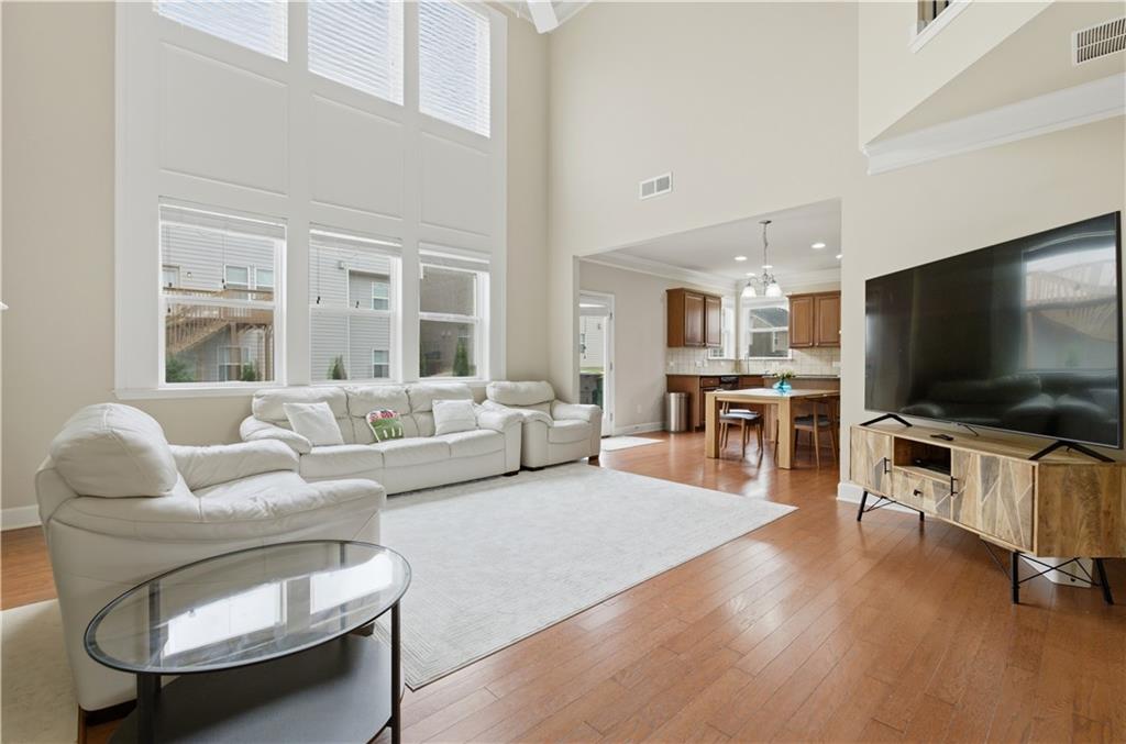 2572 Larson Creek Way Northwest Duluth, GA 30097 - Photo 16 of 50 a living room with furniture and a flat screen tv