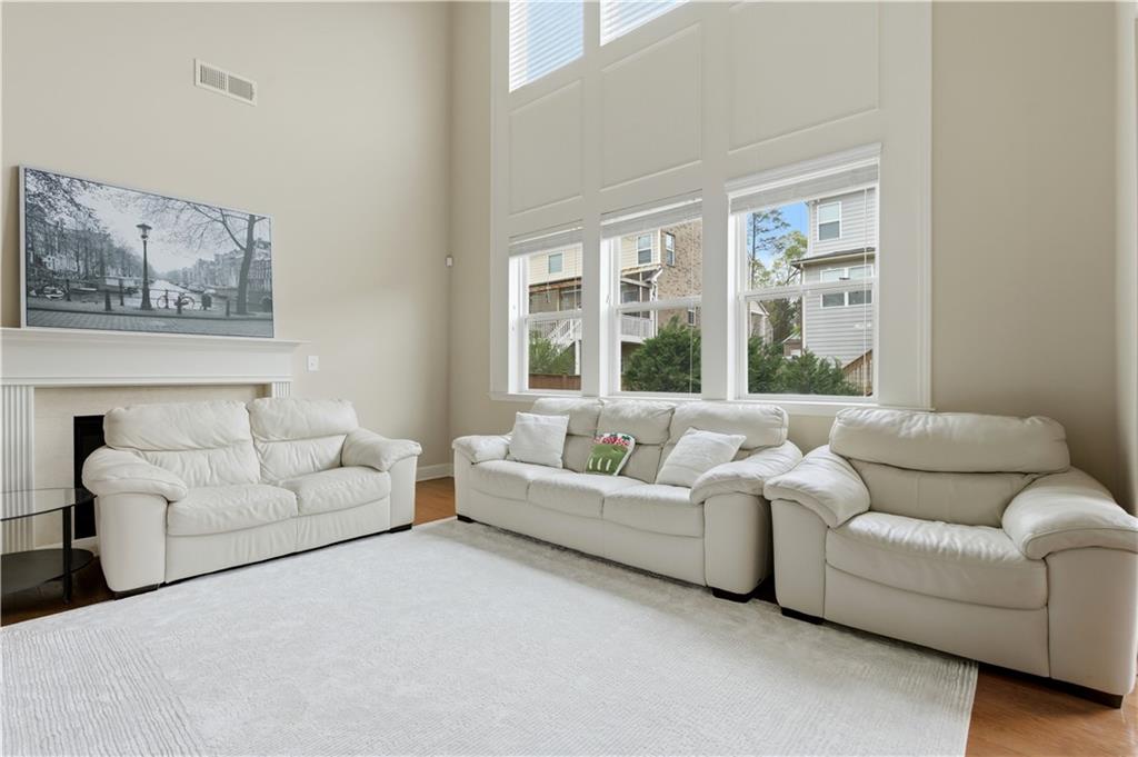 2572 Larson Creek Way Northwest Duluth, GA 30097 - Photo 17 of 50 a living room with furniture and a large window