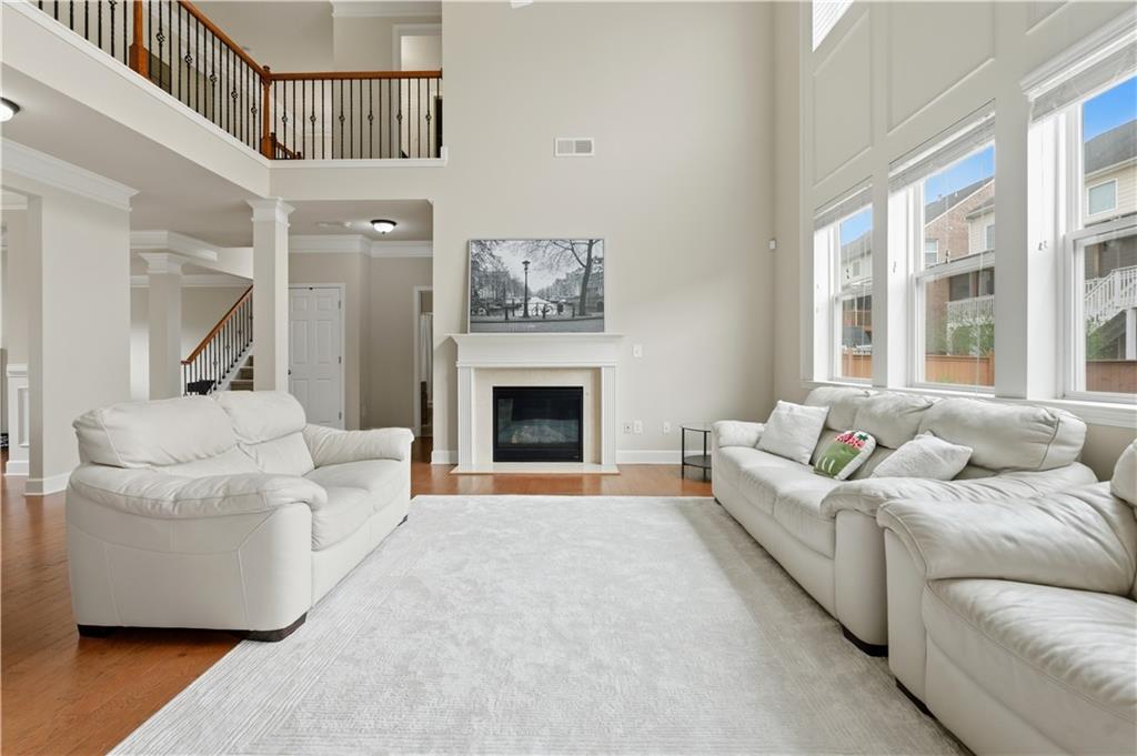 2572 Larson Creek Way Northwest Duluth, GA 30097 - Photo 19 of 50 a living room with furniture and a fireplace