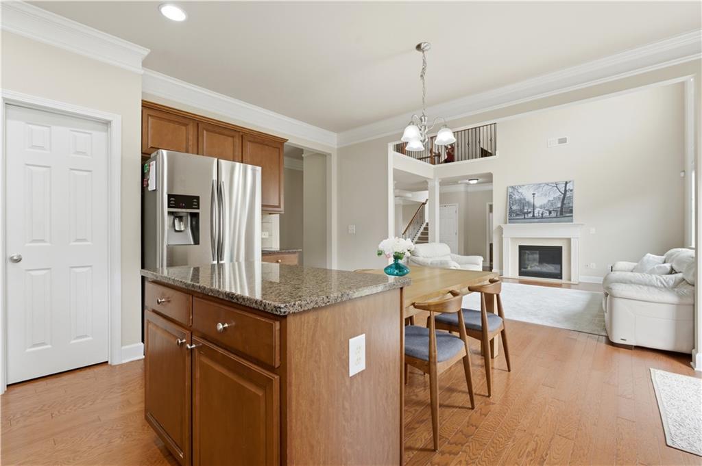 2572 Larson Creek Way Northwest Duluth, GA 30097 - Photo 20 of 50 a view of a dining room with furniture window and wooden floor