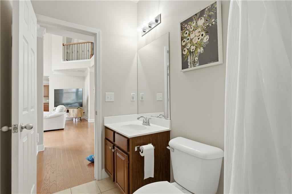 2572 Larson Creek Way Northwest Duluth, GA 30097 - Photo 27 of 50 a bathroom with a toilet sink and mirror