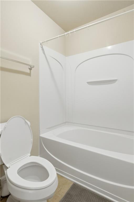 2572 Larson Creek Way Northwest Duluth, GA 30097 - Photo 30 of 50 a bathroom with a toilet and a bathtub
