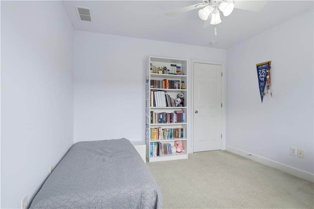 2572 Larson Creek Way Northwest Duluth, GA 30097 - Photo 35 of 50 a view of a bedroom with a bookshelf