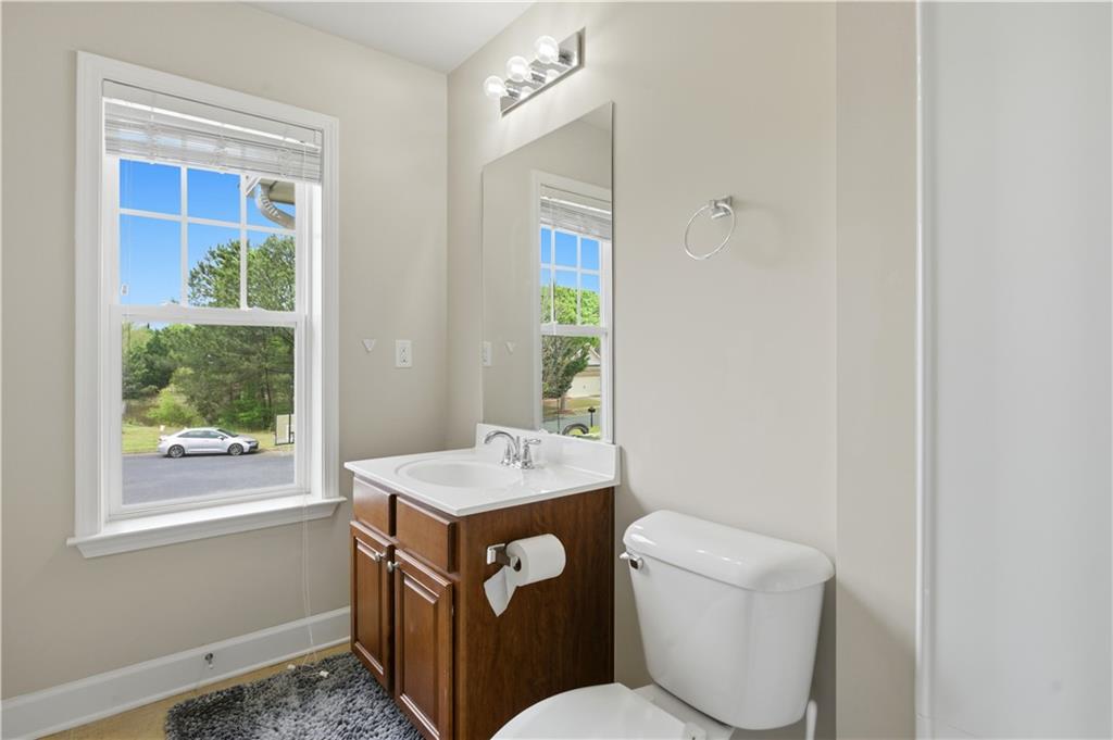2572 Larson Creek Way Northwest Duluth, GA 30097 - Photo 38 of 50 a bathroom with a toilet a sink and a window
