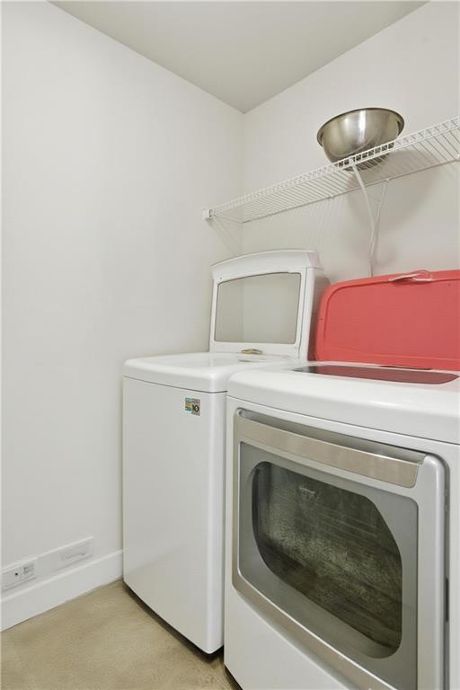 2572 Larson Creek Way Northwest Duluth, GA 30097 - Photo 39 of 50 a utility room with dryer and washer