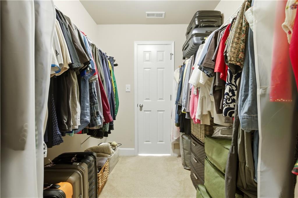 2572 Larson Creek Way Northwest Duluth, GA 30097 - Photo 48 of 50 a view of walk in closet with clothes