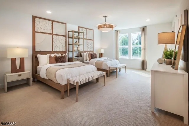 a bedroom with bed and large window