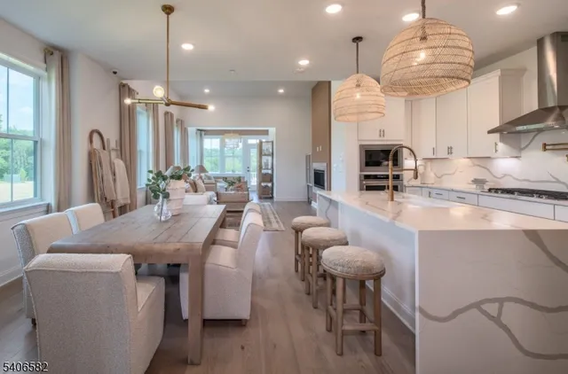 a large kitchen with a table and chairs